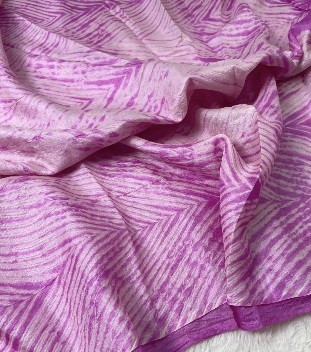 Pink-purple textured fabric identified by the founder as Tussar